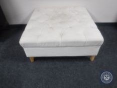 A contemporary over sized footstool