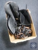 A box of leather saddle and quantity of horse bridles