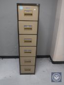 A metal six drawer archive cabinet with key