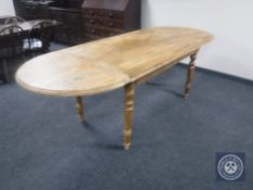 A mahogany flap end dining table