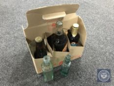Five bottles of commemorative ale together with three vintage glass bottles