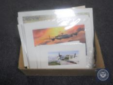 A box of framed and frameless signed limited edition prints,
