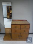 A mid 20th century mahogany linen chest fitted with a vanity mirror