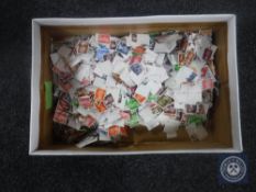 Two boxes of loose British and foreign stamps