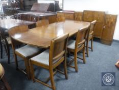 A 1930's oak drawer leaf table and six panel back chairs