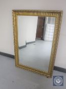 A gilt framed overmantel mirror