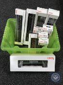 A box of Marklin HO gauge electric locomotive 37404 together with nine boxed coaches.