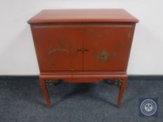A Chinoiserie double door low cabinet