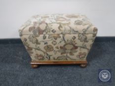 A Victorian sarcophagus storage footstool in floral fabric