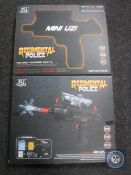 Two boxed Regimental Police mini Uzi guns