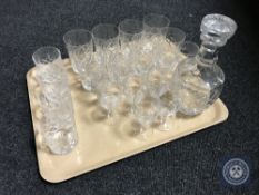 A tray of assorted lead crystal drinking glasses and a decanter