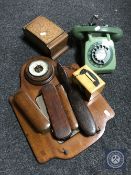 An early 20th century four-piece brush set on mirrored rack fitted with a barometer,