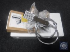 A rectangular ceramic hand basin together with a set of Moretti sink taps with matching shower tap