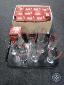 A tray of eight unboxed Coca Cola glasses together with a further twelve boxed limited edition