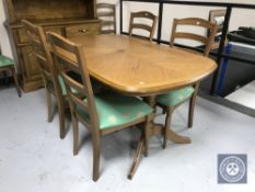 A contemporary oak dining table and six chairs