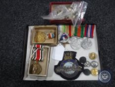 An interesting collection of WWII medals, commemorative medals, military buttons, badges etc.