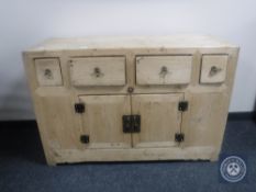 A pine sideboard fitted four drawers and cupboards beneath