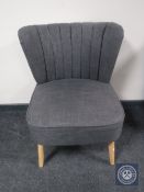 A contemporary bedroom chair and a metal standard lamp