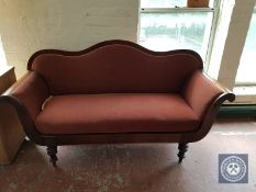A 19th century continental mahogany scroll arm settee