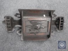 A 19th century carved oak single door corner cabinet with game bird panel door