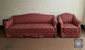 An early 20th century continental three seater settee and armchair in classical upholstery
