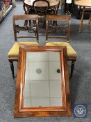 A pair of continental dining chairs and a mahogany framed mirror