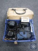 A canvas bag containing cameras to include Zenit and Practika,