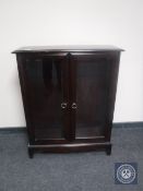 A reproduction mahogany display cabinet