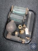 A tray of antique brass fittings