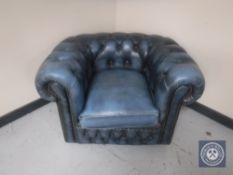 A blue button leather Chesterfield club armchair