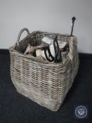 A wicker log basket containing logs,