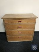 A pine four drawer chest