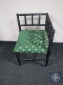 A Victorian ebonised bobbin corner chair