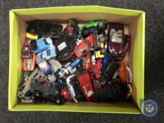 A box of play worn die cast vehicles