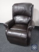 A brown leather electric reclining armchair