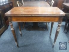 A 19th century mahogany foldover tea table