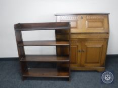 A reproduction oak bureau and a set of walnut open shelves