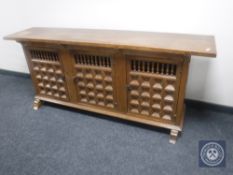 An Eastern style triple door sideboard