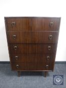 A mid 20th century teak five drawer chest