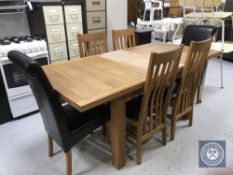 A contemporary oak extending table with leaf,