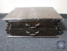 A wooden two drawer chest in leather effect finish