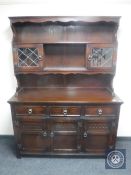 An oak triple door dresser