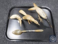 Three horn bird figures and a horn and white metal spoon