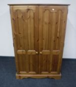 A pine double door computer cabinet