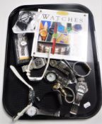 A tray of a collection of lady's and gent's wristwatches,