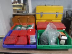 A metal concertina tool box, three plastic trays of nails,