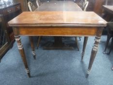 A 19th century mahogany foldover tea table