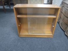 A set of teak bookshelves (one glass door missing)