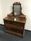 An Edwardian mahogany four drawer dressing chest