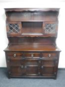 An oak triple door dresser